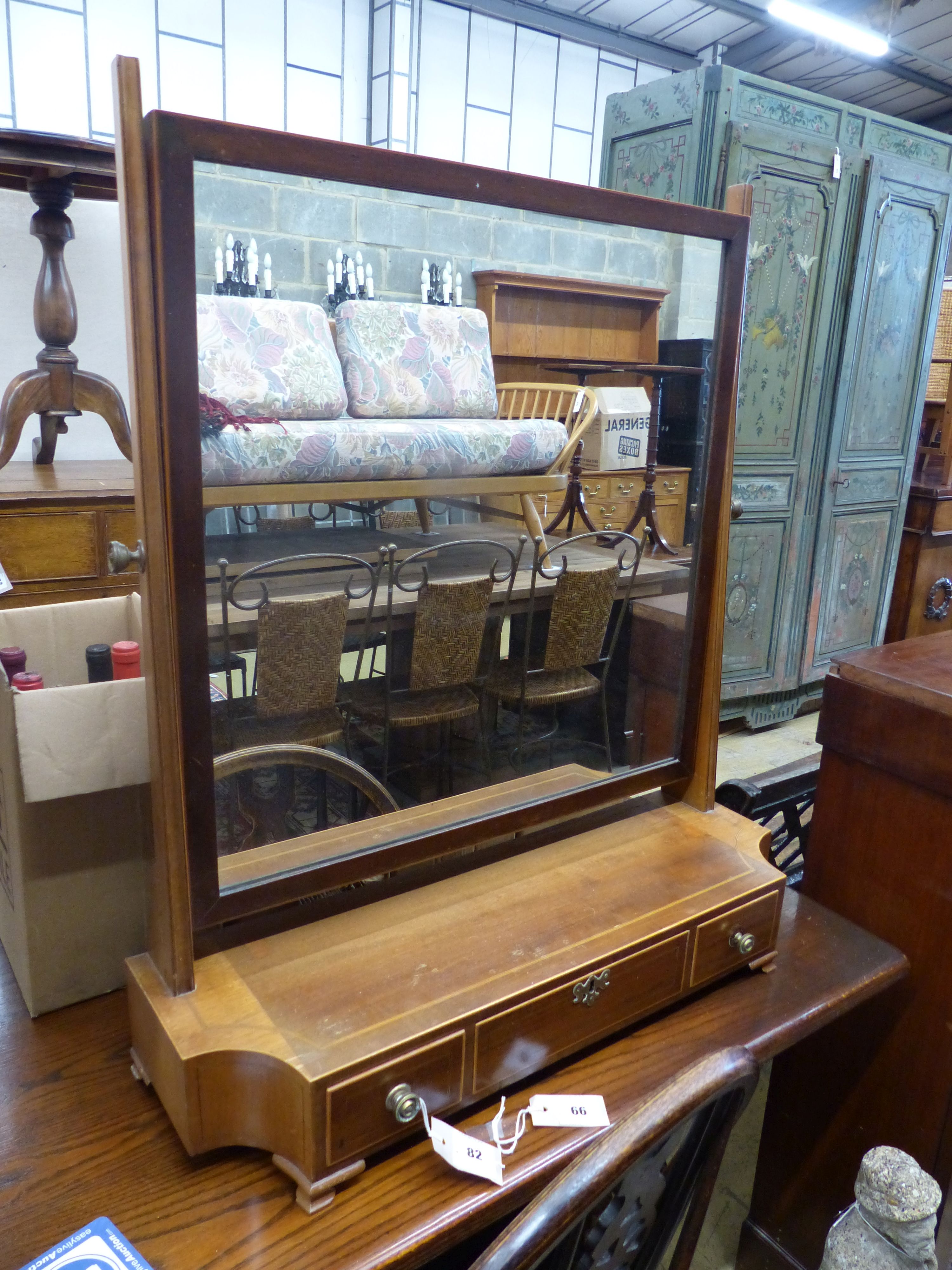 An Edwardian mahogany toilet mirror, width 71cm, depth 22cm, height 84cm